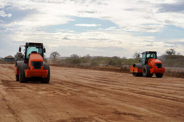 roller machine compacts the road