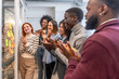 © unai - Colleagues applauding after a successful meeting in a coworking