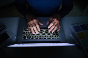 Wall Mural - Close up on hands typing on laptop, man at homeoffice at evening. Telecommuting and home office.