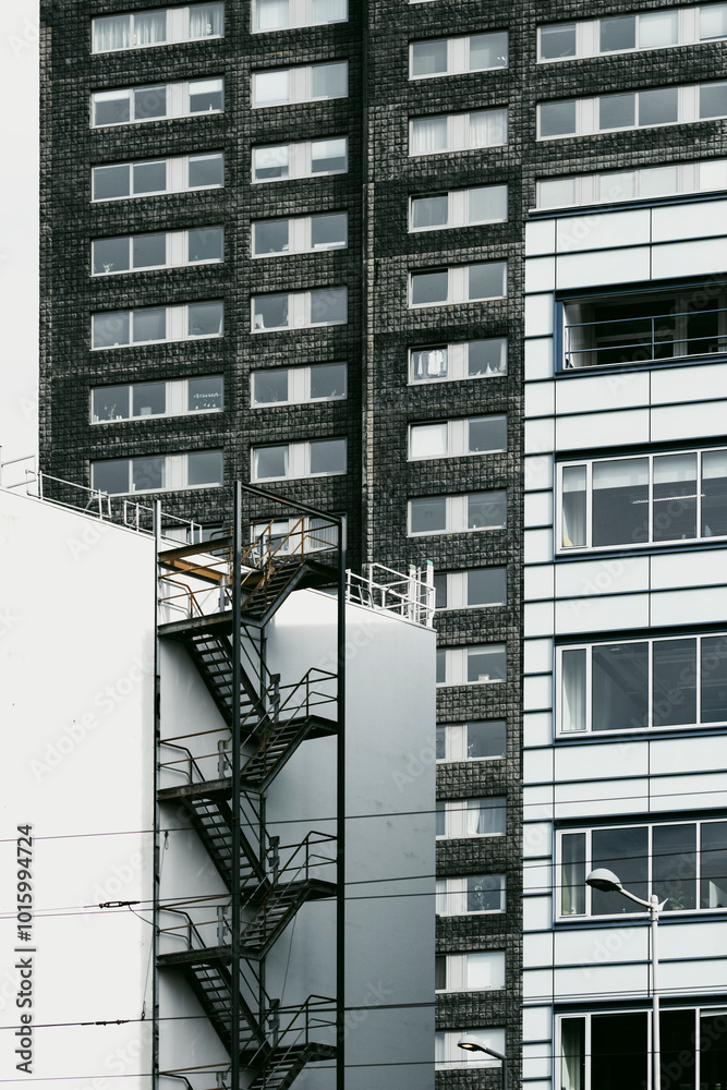 Curated visual reference: Visual Reference: An Urban Landscape Highlighting Industrial Elements And Fire Escape