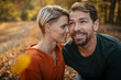 © Halfpoint - Couple in love on a walk in autumn forest. Husband and wife standing in the middle of forest, touching with foreheads.