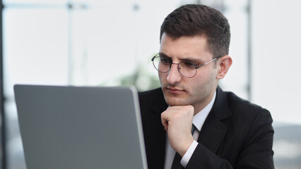 male worker planning internet solution on computer technology for project research