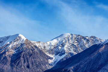 Wall Mural - soft summer sky and snow tipped mountains of forsbladfjorden in northeast greenland national park. s