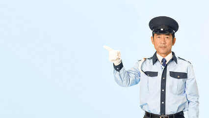 Leinwandbilder - 指さし案内する男性警備員