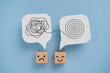 © Ratana21 - Mental health, brain disorder, World mental health day, Alzheimer, Psychology concept. Tangle of thoughts and clear line on real   white speech bubbles paper cut and emoticon face on cube blocks
