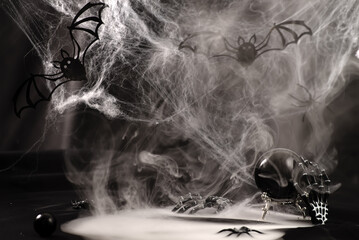 Divination ball, candles, skeleton and spider- a fall witch's Halloween scene.