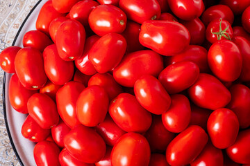 Close-up ripe red tomatoes. Harvest concept, home canning. Background.