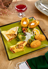 Sticker - Delicious Mexican Appetizer Platter with Tortilla, Burrito, Croquettes, Baked Potato, Salad, and Guacamole