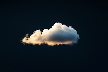 Fototapete - This serene image captures a singular bright cloud brilliantly illuminated by warm light, creating a tranquil sight against the backdrop of a deep, dark night sky.