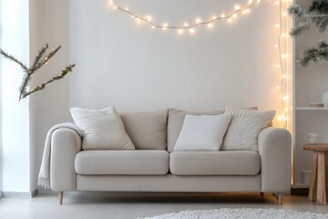 Leinwandbilder - A minimalist living room showcasing a neutral-toned couch with textured cushions, accentuated by a subtle string light arrangement, offering a tranquil ambiance.