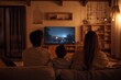 © milkyway - Family Enjoying Cozy Streaming Movie Night in Comfortable Living Room
