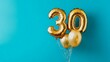 © ryanbagoez - Banner with number 30 golden balloon with copy space. thirty years anniversary celebration concept on a blue background