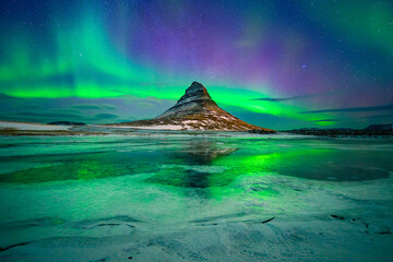 Wall Mural - aurora borealis or northern lights over kirkjufell mountain in iceland