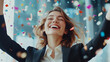 © Ruslan - Happy businesswoman celebrating success or victory in office with falling confetti