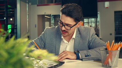 Poster - a focused professional works on a project in a modern office setting during midday hours