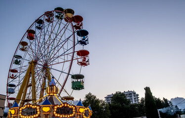 Ferris wheel in the evening at sunset.