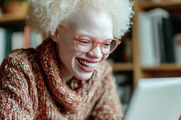Poster - Senior woman using laptop with white hair and glasses.