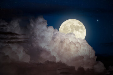 full moon covered by strong cloud