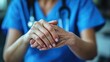 © Feeney - portrait of nurse holding hand to senior client.stock image