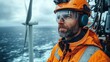 © Feeney - professional technician performing a routine inspection and maintenance service on a wind turbine focusing on the rotor blade checkup to ensure optimal performance and safety.stock image