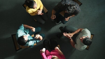 Sticker - Top down aerial view of business people clap hands together to celebrate successful project while sitting chair circle. Aerial view of skilled marketing team applause successful project. Symposium.