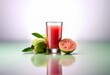 © YiuCheung - A glass of guava juice sits on a reflective surface next to a whole guava and a halved guava.