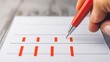 © rookielion - Close-up of a hand holding a red pen, writing on a blank paper with red lines, ideal for crafting, planning, or organizing