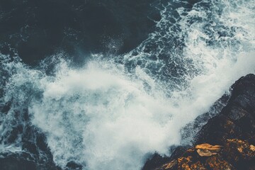 Sticker - A person surfing on a big wave in the ocean, with sea spray and sunlight.