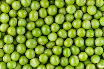 Wall Mural - Fresh green peas in a tight cluster.