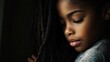 © svastix - A close-up portrait of a child with thoughtful expression holding hair gently, capturing innocence and introspection in a beautifully lit environment.