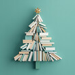 © carolina - Christmas tree made of books on a green background, , Christmas concept representing the holiday season and reading day,