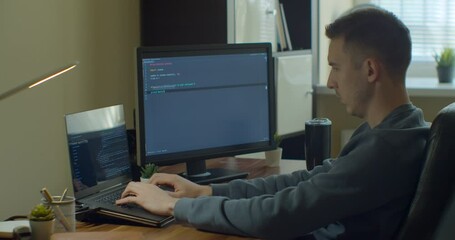 Man coding html and programming on screen Monitors, development web, developer.