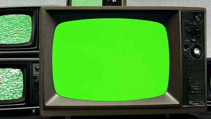 video of television stack coming life withgreen screen display engaging footage captures black white tones screens allowing replace green background desired using