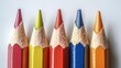© arhendrix - Close-up of five colorful pencils aligned in a row, showcasing variety and vibrancy. Ideal for art, education, and creativity themes.