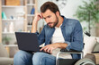 © auremar - angry young disabled man with laptop
