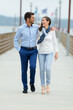 © auremar - young couple walking on pier