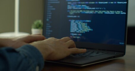 Closeup coding on screen, Man hands coding html and programming on screen laptop, development web, developer.