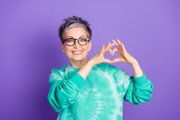 Sticker - Photo portrait of pretty retired female show heart symbol wear trendy green outfit isolated on violet color background