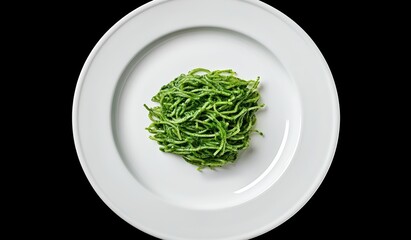 An Italian traditional pasta dish with olive oil and garlic, served on a rustic black background with fresh basil and parmesan.