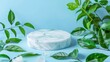 © Bilal - White marble podium with green leaves and flowers on blue background. Natural product display