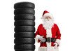 © Ljupco Smokovski - Santa claus leaning on a pile of car tires