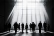© Lubos Chlubny - Business people walking in corridor with bright light coming from large windows