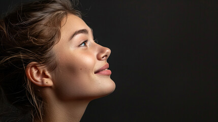 Wall Mural - Side view young happy woman, close up, mock up area isolated on plain black background