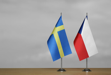 Table flags of Sweden and Czech Republic on grey blurred background