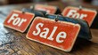 © aicandy - Vintage For Sale signs on a wooden table in close-up, representing the concept of selling retro items, antiques, or real estate with a nostalgic touch