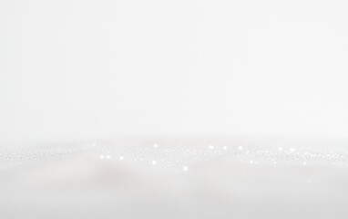 Poster - A soft white background with sparkling light particles glimmering in a dreamy atmosphere at a serene moment