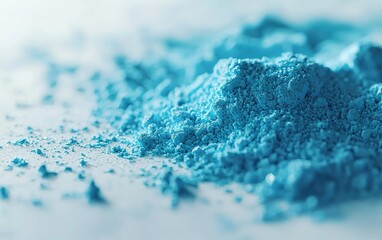 Poster - Bright blue powder scattered on a white surface, showcasing fine texture and vivid color in a close-up view