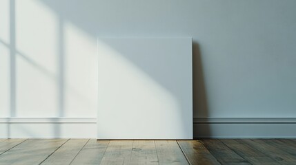 Poster - A blank canvas leaning against a wall, illuminated by natural light, suggesting creativity.