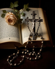 Vintage rosary with crucifix on an open Bible