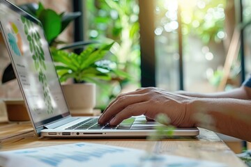 Designer hand working on laptop for web design concept.